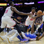 Butler's acrobatic layup, 23 points lead Heat past 76ers
