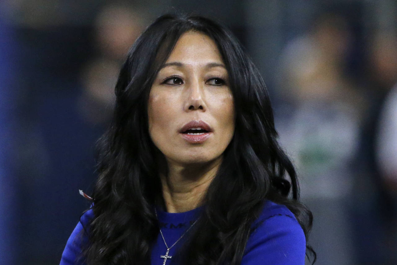 FILE - Buffalo Bills co-owner Kim Pegula stands on the field  before an NFL football game, in Arlin...