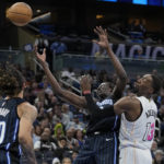 Heat use balanced scoring, rally to beat Magic 106-103 in OT