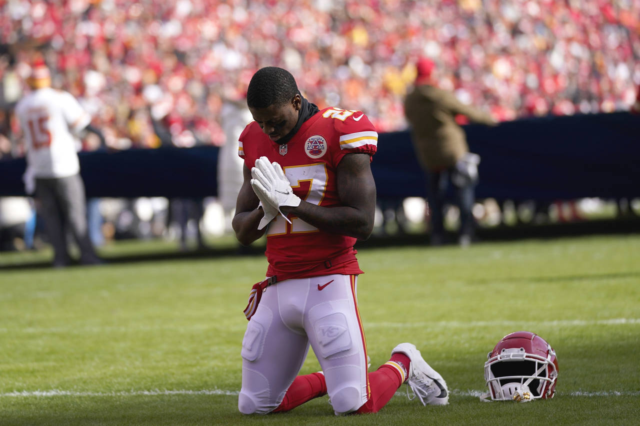 FILE - Kansas City Chiefs cornerback Rashad Fenton kneels on the field before the AFC championship ...