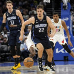 Heat use balanced scoring, rally to beat Magic 106-103 in OT