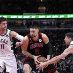 Giannis sets assists mark, hurts wrist; Bucks beat Bulls