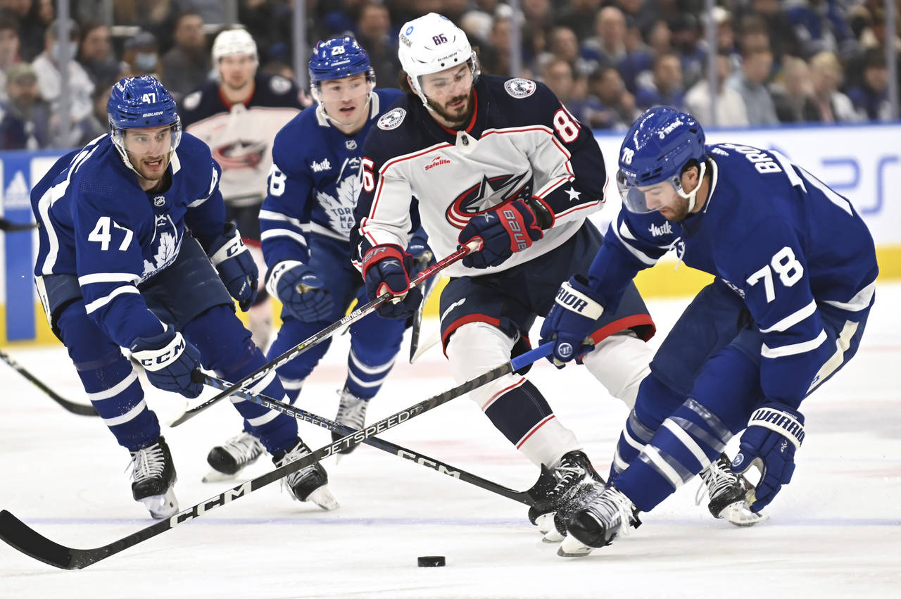 Toronto Maple Leafs defenceman T. J. Brodie (78) controls the puck against Columbus Blue Jackets ri...