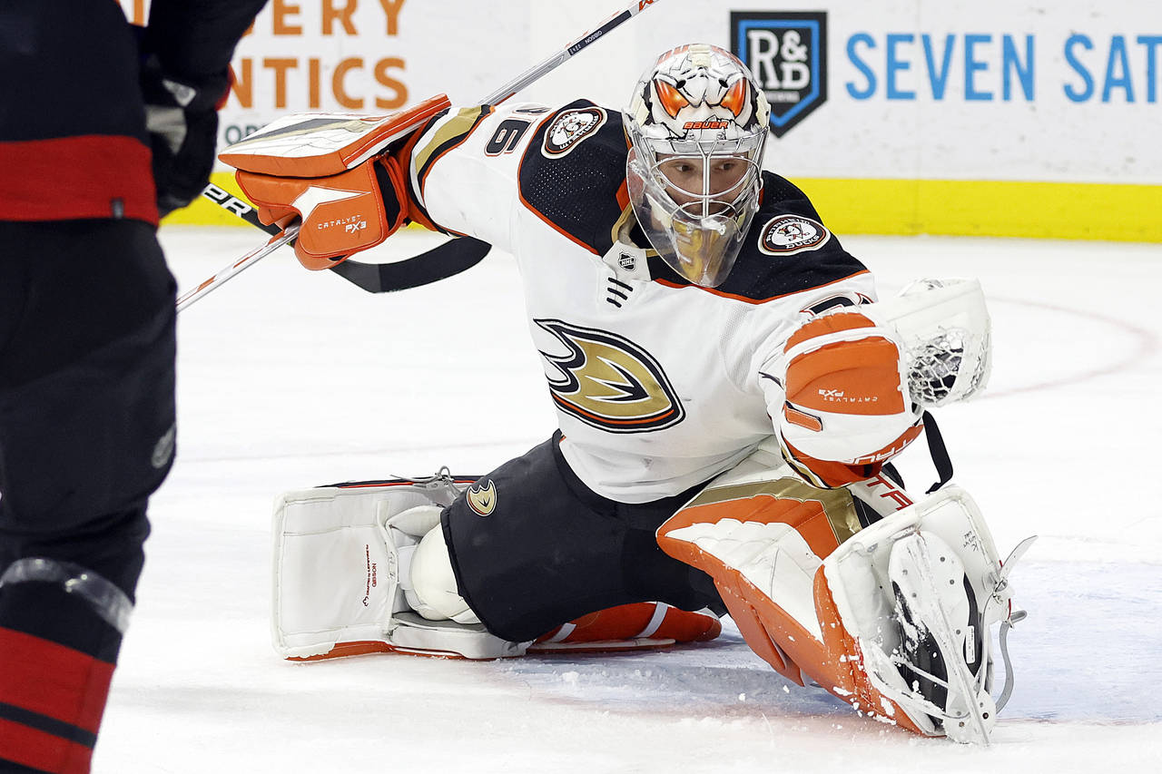 Anaheim Ducks goaltender John Gibson (36) gloves a shot from the Carolina Hurricanes during the sec...