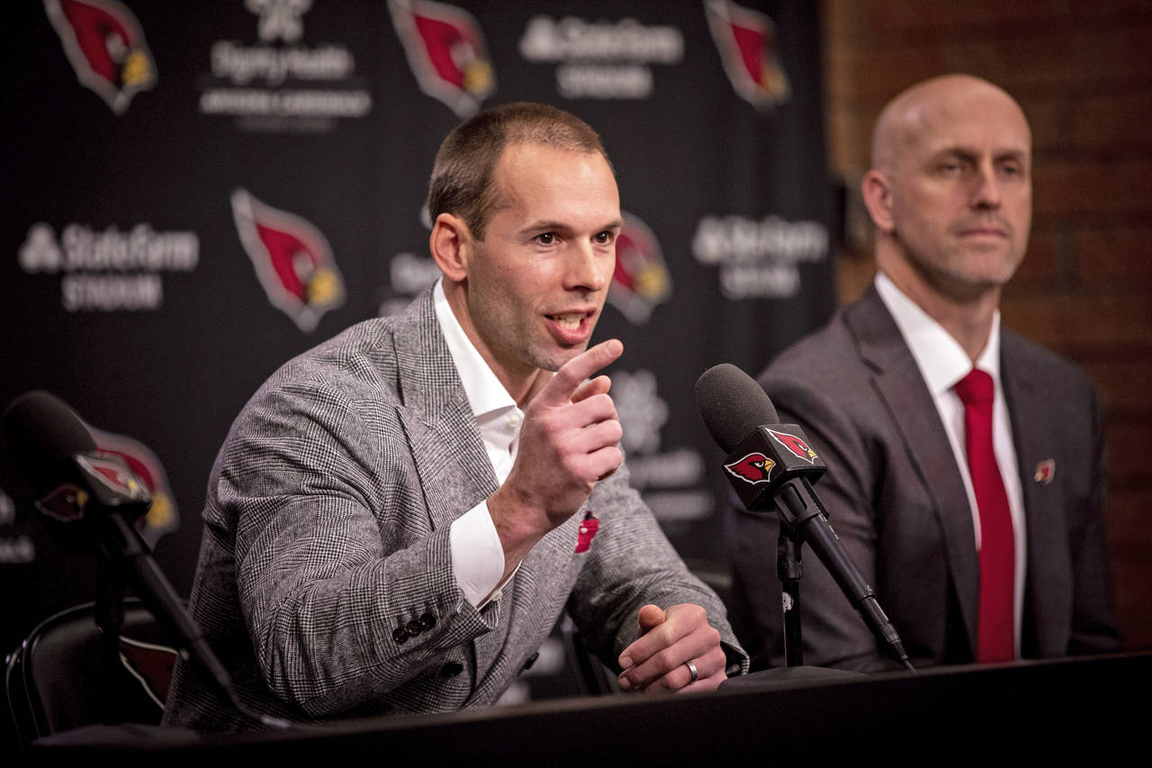 Arizona Cardinals new head coach Jonathan Gannon, left, speaks during an NFL football press confere...
