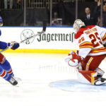 Lafreniere scores in OT to lift Rangers over Flames 5-4