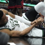 Giannis sets assists mark, hurts wrist; Bucks beat Bulls
