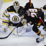 McAvoy scores in OT, Bruins beat Flames as win streak hits 8