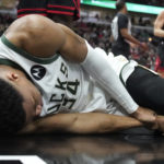 Giannis sets assists mark, hurts wrist; Bucks beat Bulls