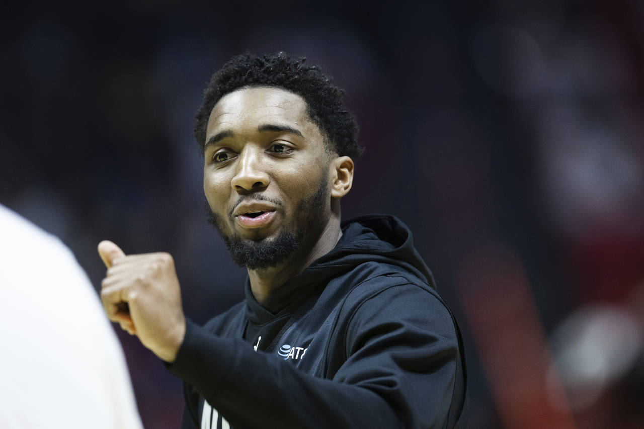 Former Utah Jazz guard and current Cleveland Cavalier Donovan Mitchell greets a trainer during the ...