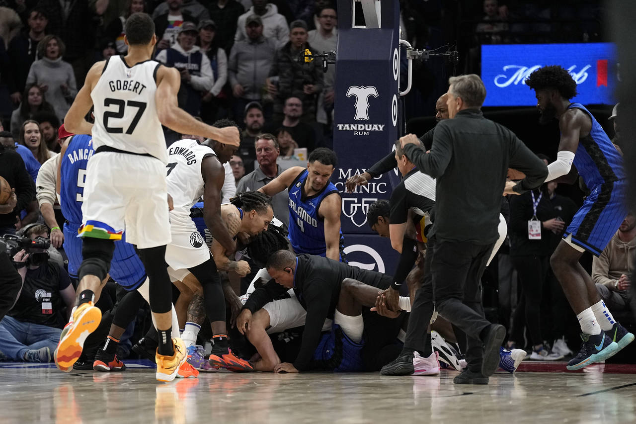 A scrum breaks out between Minnesota Timberwolves and Orlando Magic players during the second half ...