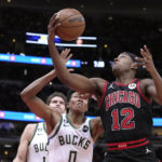 Giannis sets assists mark, hurts wrist; Bucks beat Bulls