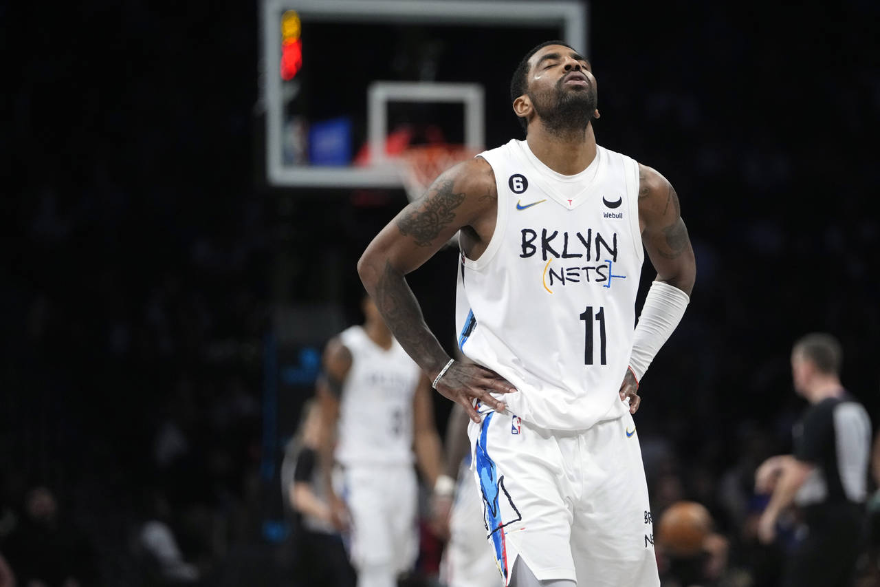FILE -  Brooklyn Nets' Kyrie Irving reacts during the second half of the team's NBA basketball game...