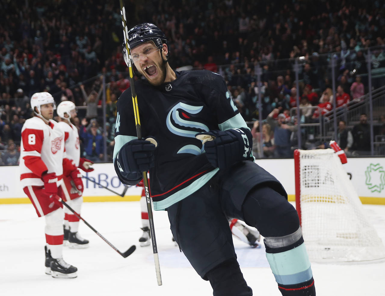 Seattle Kraken defenseman Jamie Oleksiak (24) reacts after scoring a goal against the Detroit Red W...