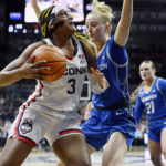 Behind Ducharme, No. 6 UConn rallies past Creighton 62-60