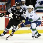Bratt power-play OT goal gives Devils 5-4 win over Canucks