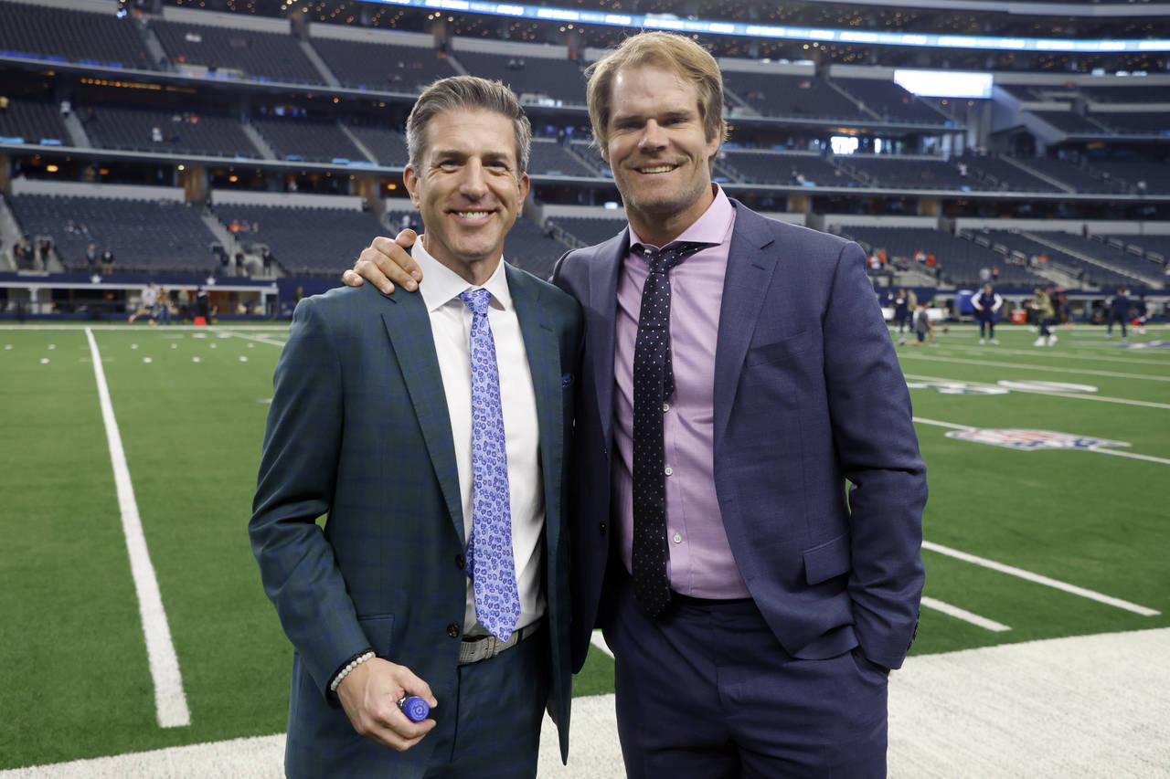 FILE - FOX Sports play-by-play announcer Kevin Burkhardt, left, with game analyst Greg Olsen, right...