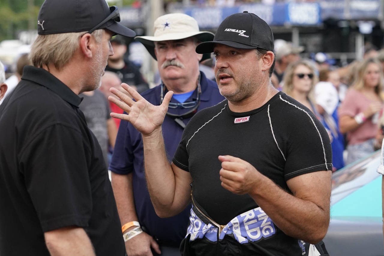 FILE - Tony Stewart, right, talks before an SRX Series auto race in Nashville, Tenn., July 17, 2021...