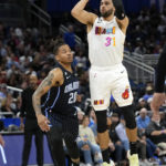 Heat use balanced scoring, rally to beat Magic 106-103 in OT