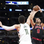 Giannis sets assists mark, hurts wrist; Bucks beat Bulls