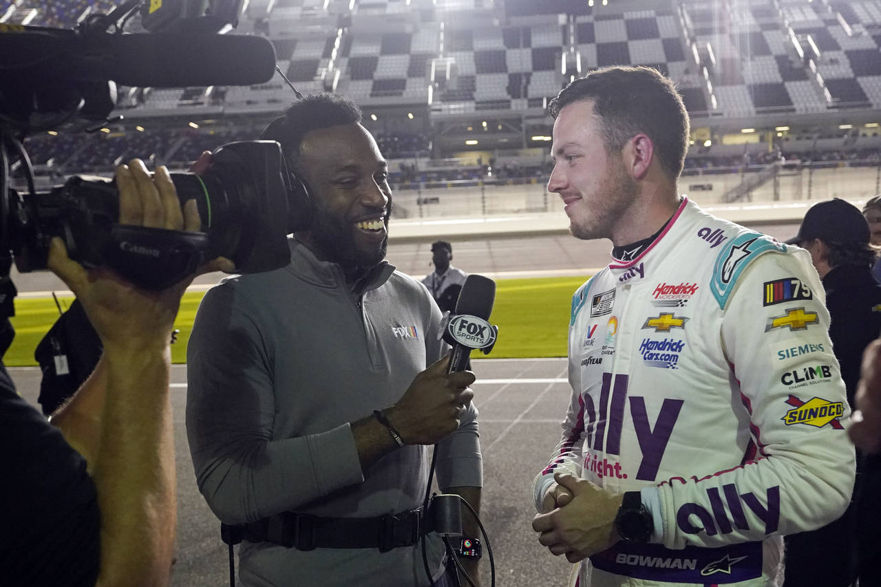 Josh Sims, left, of FOX Sports interviews Alex Bowman after he qualified for the pole position in t...