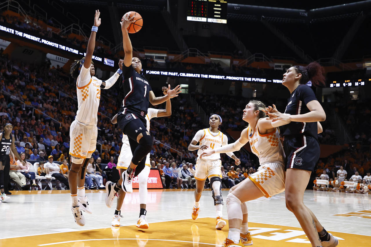 South Carolina guard Zia Cooke (1) shoots past Tennessee forward Rickea Jackson (2) during the seco...