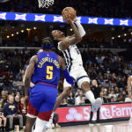 Morant scores 23, Grizzlies rout Nuggets in West showdown