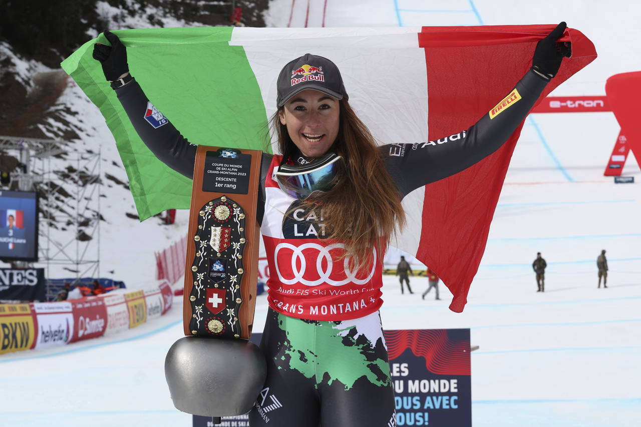 Italy's Sofia Goggia celebrates after winning an alpine ski, women's World Cup downhill race in Cra...