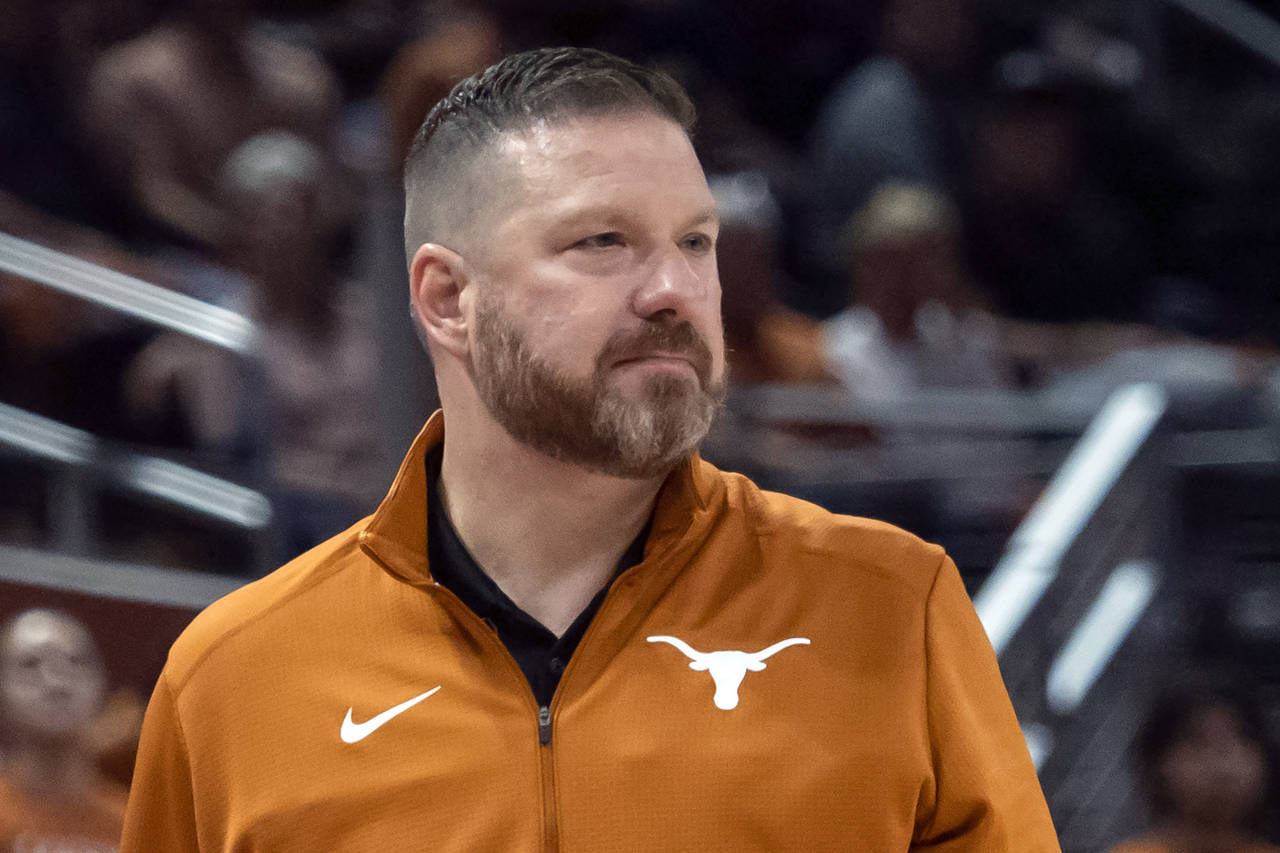 FILE - Texas head coach Chris Beard looks on during the first half an NCAA college basketball game ...