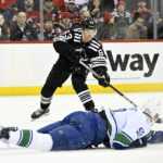 Bratt power-play OT goal gives Devils 5-4 win over Canucks