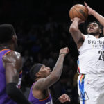 Ayton has 35, Suns hold off Thomas, Nets in Booker's return