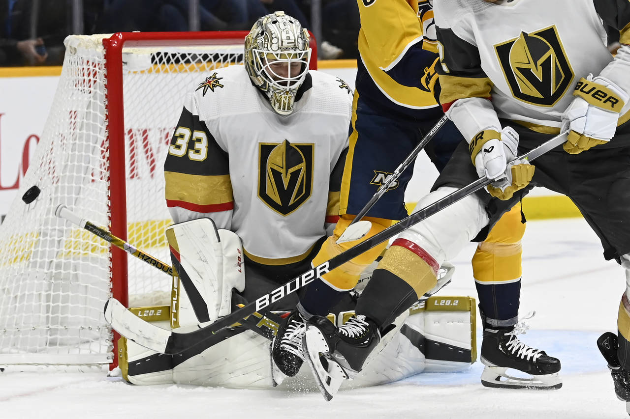 Vegas Golden Knights goaltender Adin Hill (33) deflects a Nashville Predators shot during the secon...