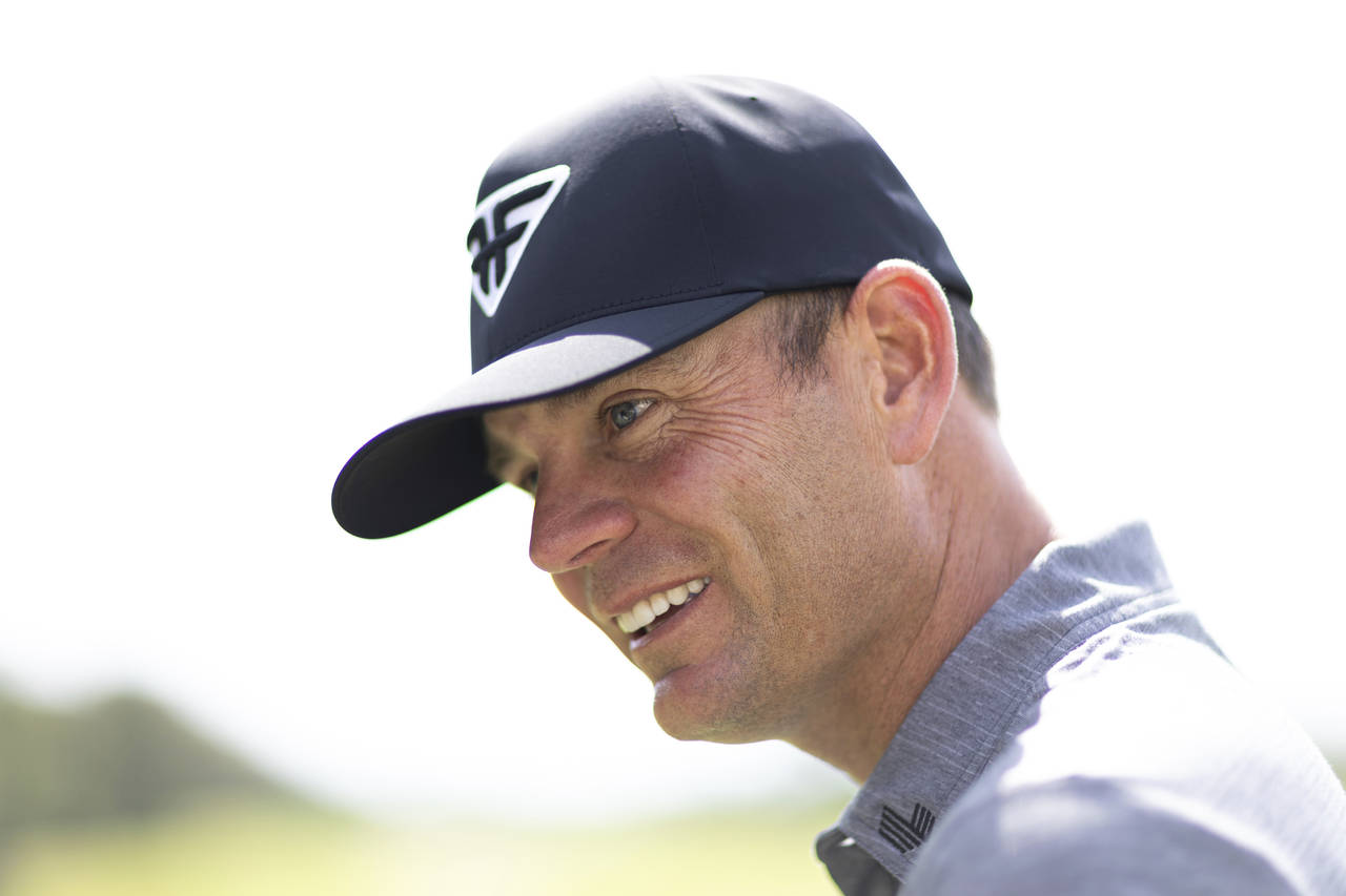 Brendan Steele of HyFlyers GC speaks to a contestant on the driving range during the first round of...