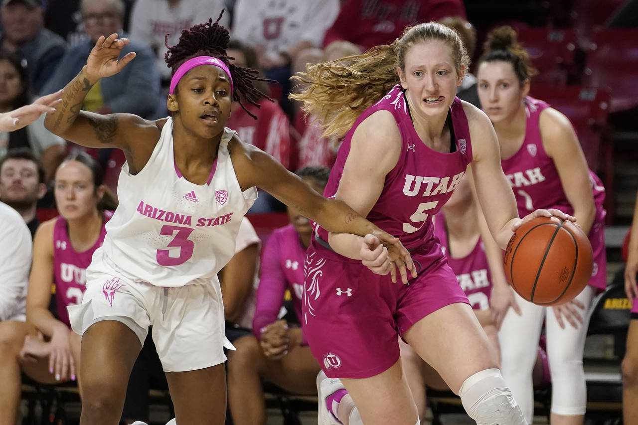 Utah's Gianna Kneepkens (5) drives the baseline against Arizona State's Tyi Skinner (3) during the ...