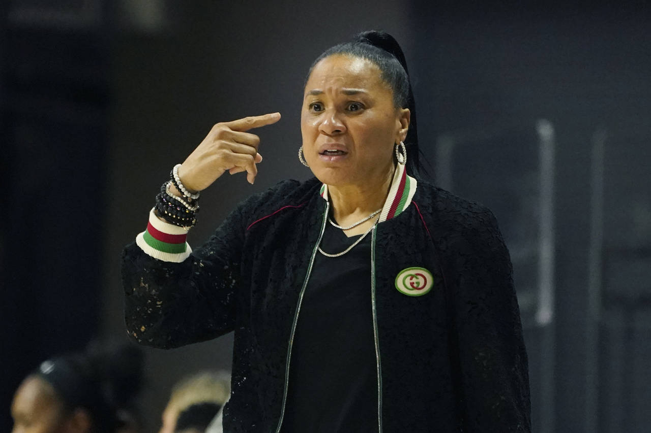 South Carolina head coach Dawn Staley gestures to her players during the first half of an NCAA coll...