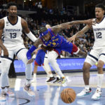 Morant scores 23, Grizzlies rout Nuggets in West showdown