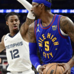 Morant scores 23, Grizzlies rout Nuggets in West showdown
