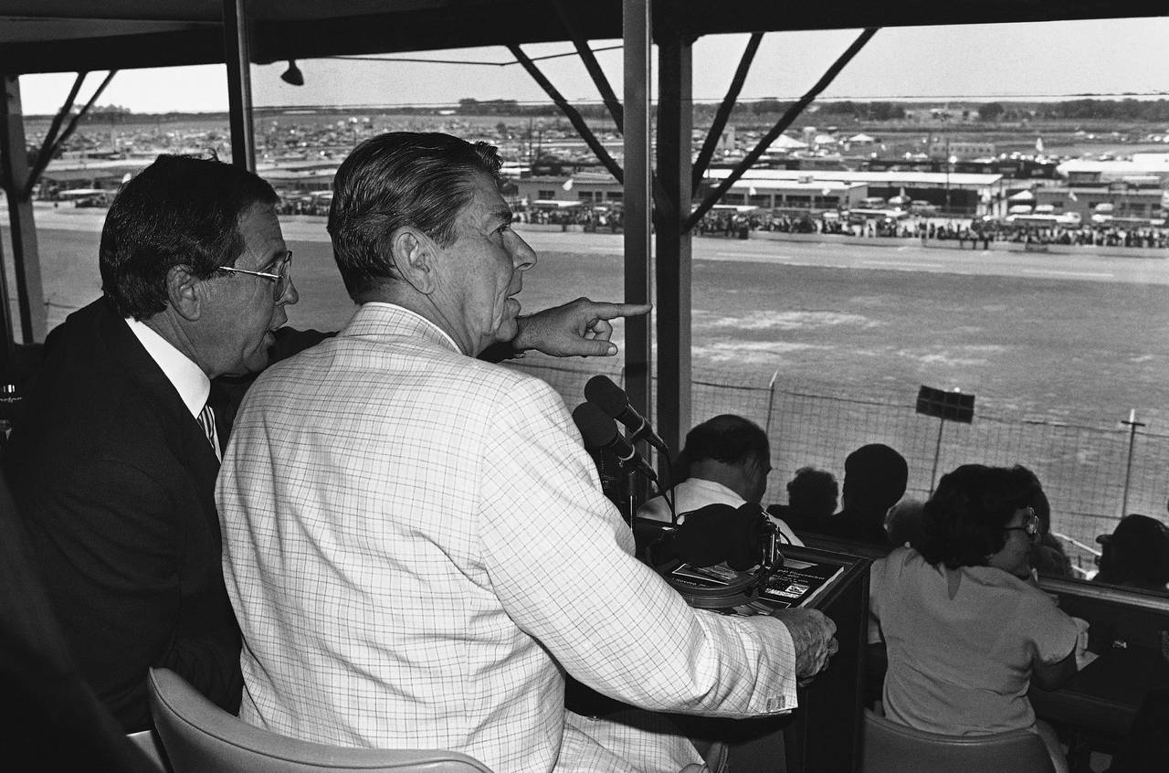 FILE - President Ronald Reagan, front right, sits with William France Jr., president of NASCAR and ...