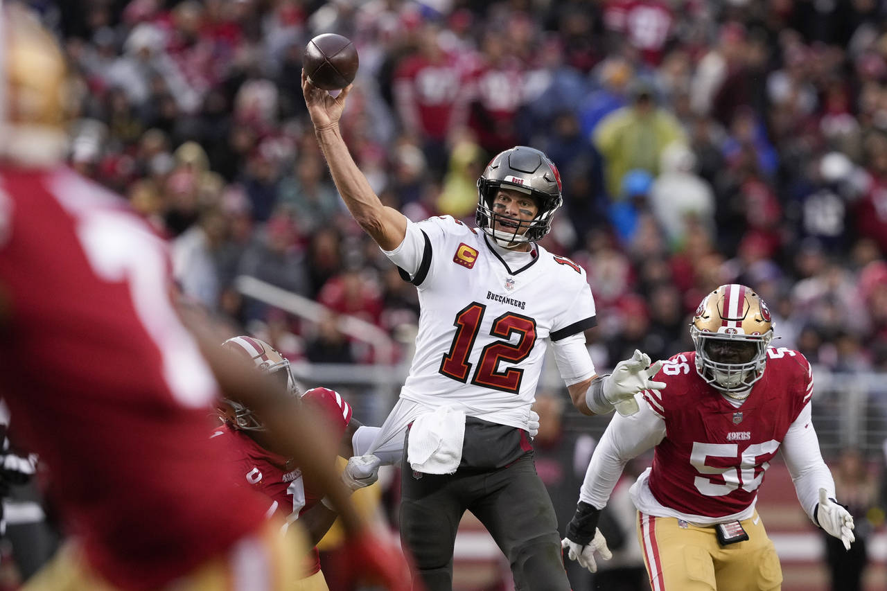 FILE - Tampa Bay Buccaneers quarterback Tom Brady (12) passes the ball as San Francisco 49ers corne...