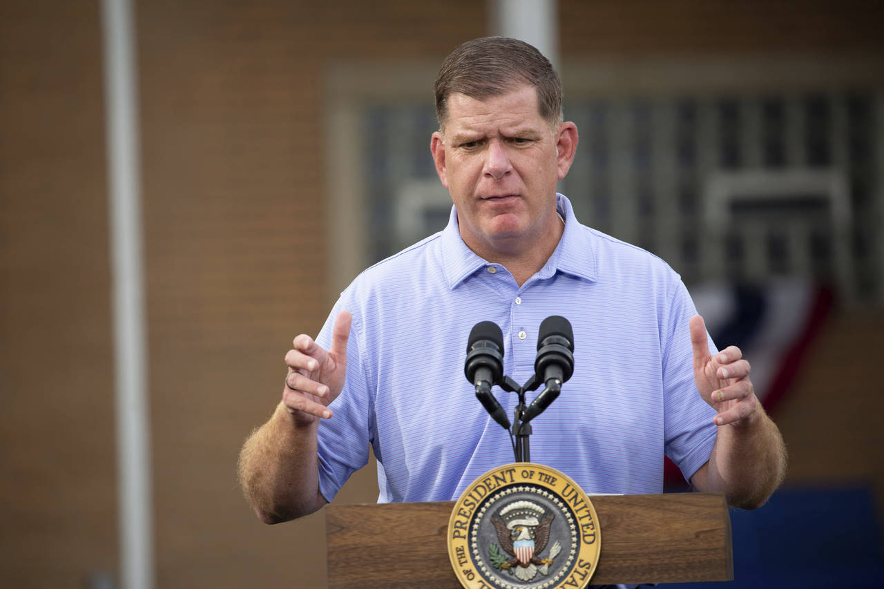 FILE - Secretary of Labor Marty Walsh speaks before President Joe Biden at a United Steel Workers o...