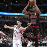 Giannis sets assists mark, hurts wrist; Bucks beat Bulls