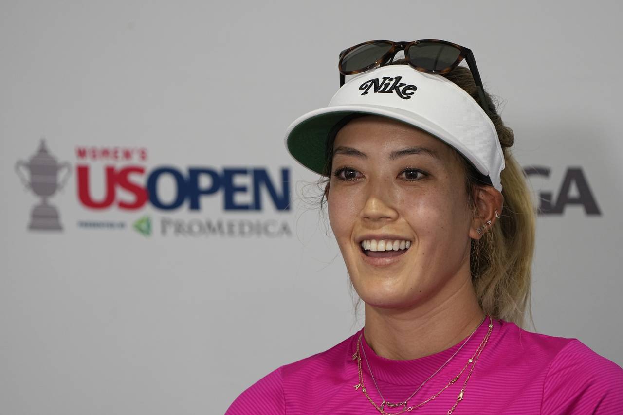 FILE - Michelle Wie West speaks during a news conference after a practice round for the U.S. Women'...