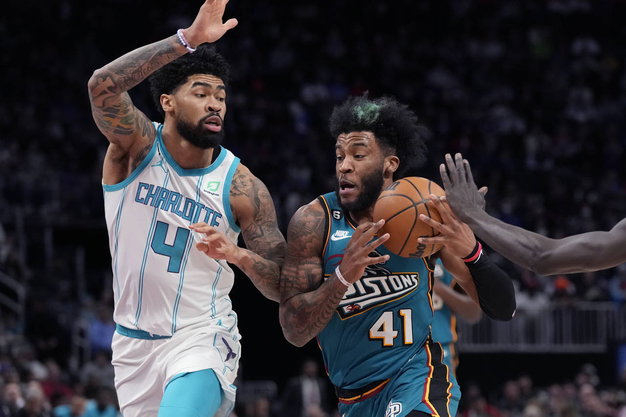 Detroit Pistons forward Saddiq Bey (41) drives as Charlotte Hornets center Nick Richards (4) defend...